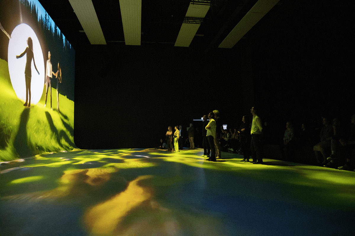 SAM AI Experience at Nxt Museum for Vivendi guests viewing large immersive screens with storytelling purpose