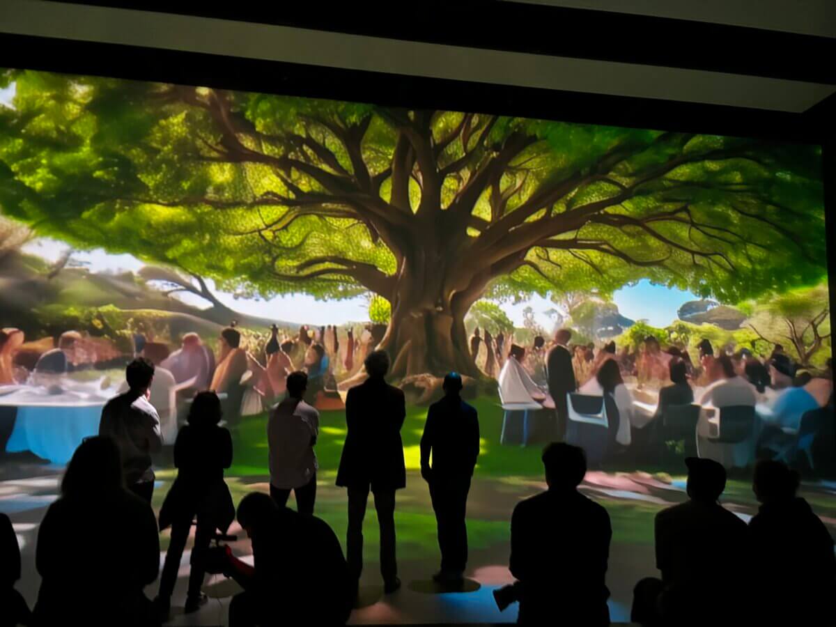 SAM AI Experience at Nxt Museum for Vivendi guests viewing large immersive screens with trees and storytelling purpose
