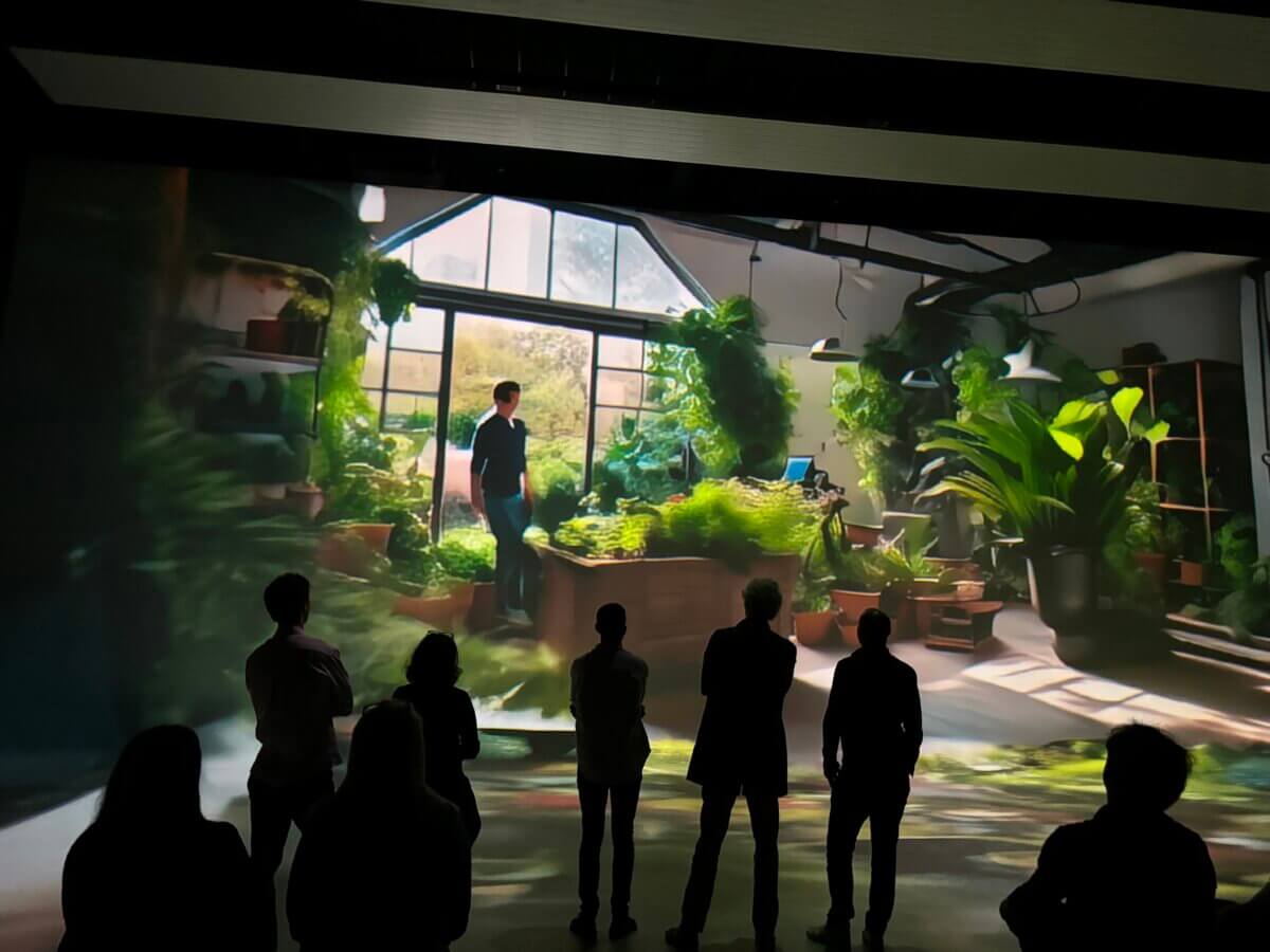 SAM AI Experience at Nxt Museum for Vivendi guests viewing their personal reflections on large immersive screens with storytelling purpose plants and nature